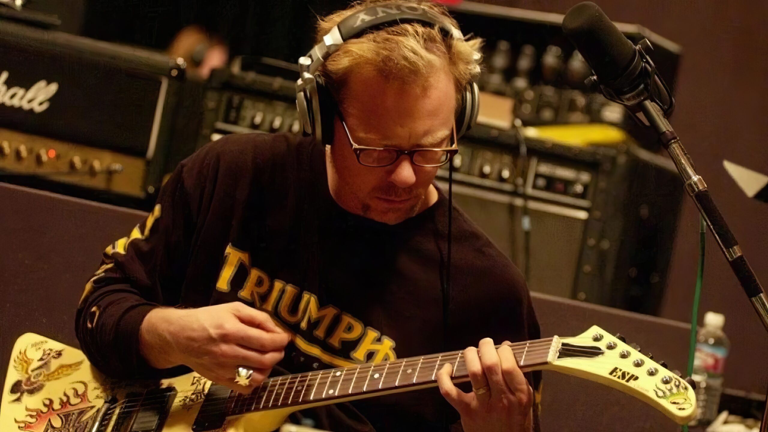 A man playing guitar.